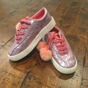 Girls Tretorn sneakers with fuzzy pouf ties.